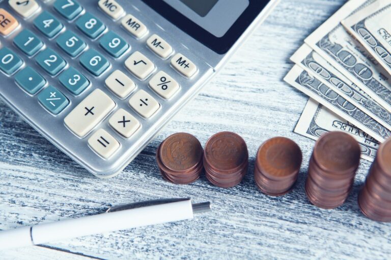 Calculator and cash representing the cost of California probate