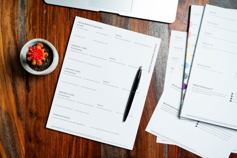 California small estate paperwork and a pen laid out on a wooden table