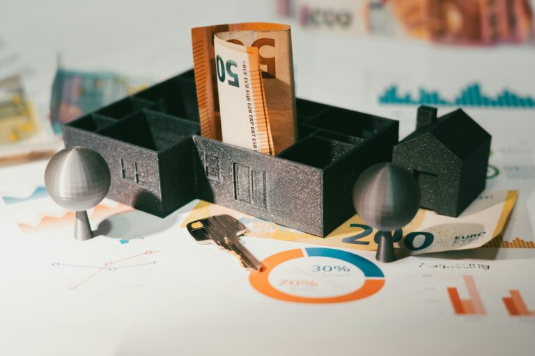 House model with banknotes and a door key representing protected home equity under the California homestead exemption