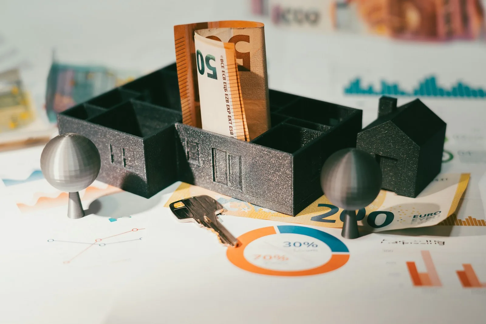 House model with banknotes and a door key representing protected home equity under the California homestead exemption