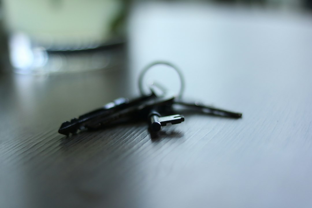 House keys resting on a table with trust and estate documents