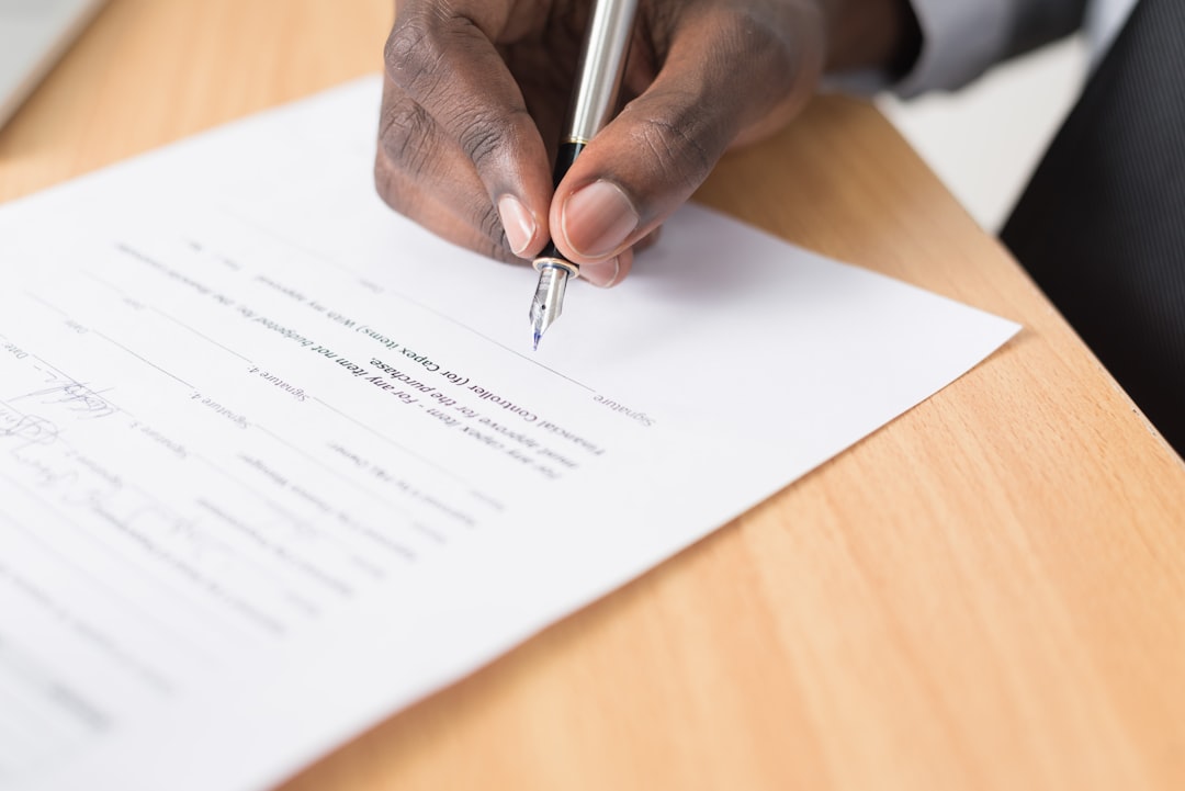 Person signing a legal document related to a property lien