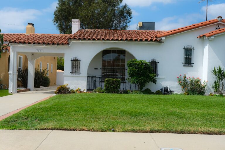 White stucco house with red tile roof in a Los Angeles residential neighborhood