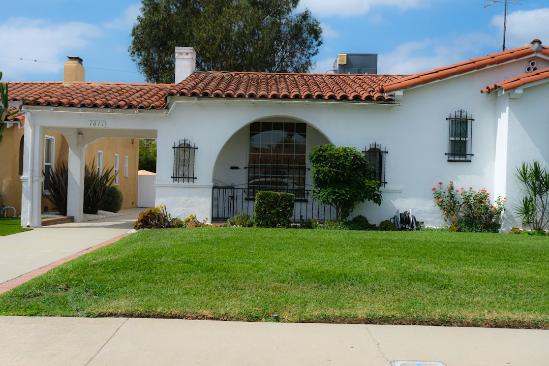 White stucco house with red tile roof in a Los Angeles residential neighborhood