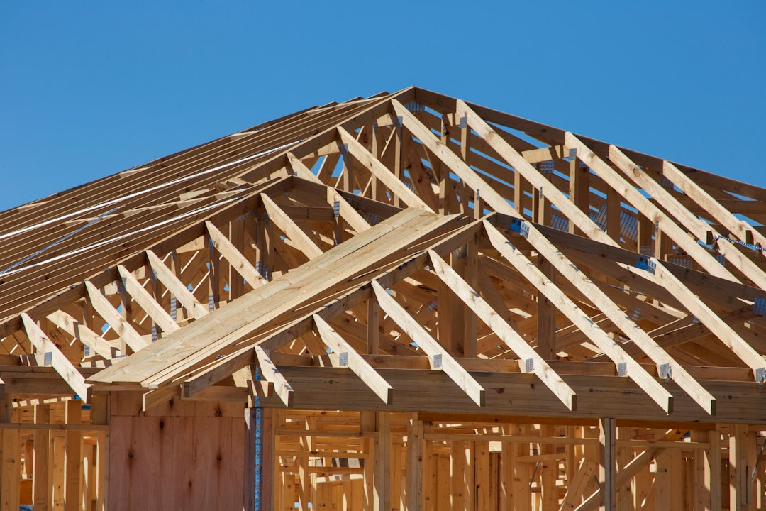 New home under construction with timber framing and roof trusses