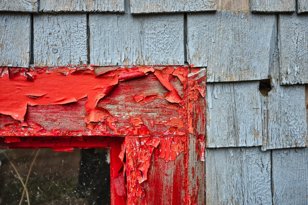 Weathered older house exterior representing a property with code violations in California