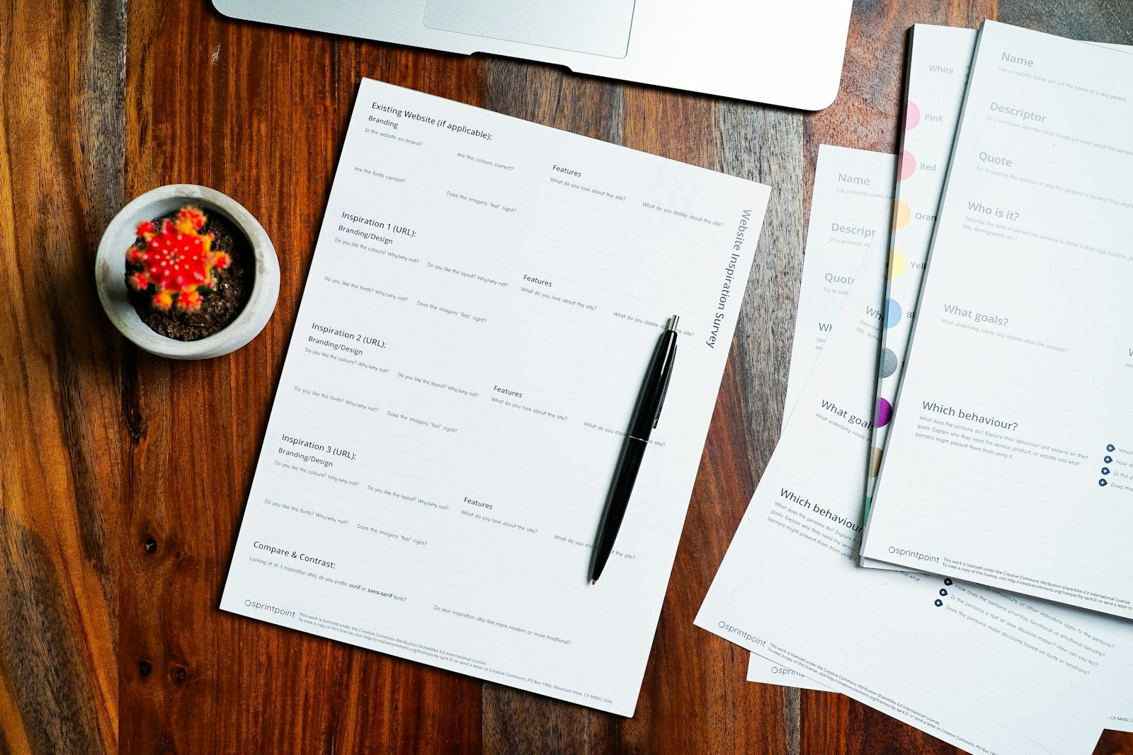 Recorded property documents and a pen on a wooden table, representing a title report showing recorded liens
