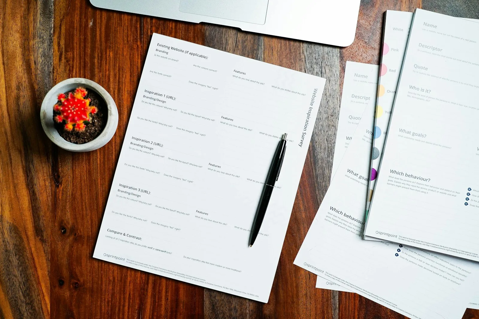 Recorded property documents and a pen on a wooden table, representing a title report showing recorded liens