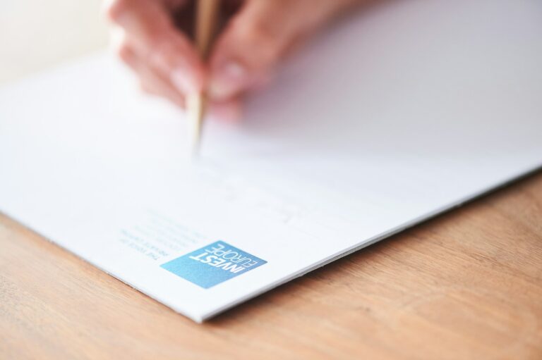 Hand signing a property document representing execution of a California quitclaim deed