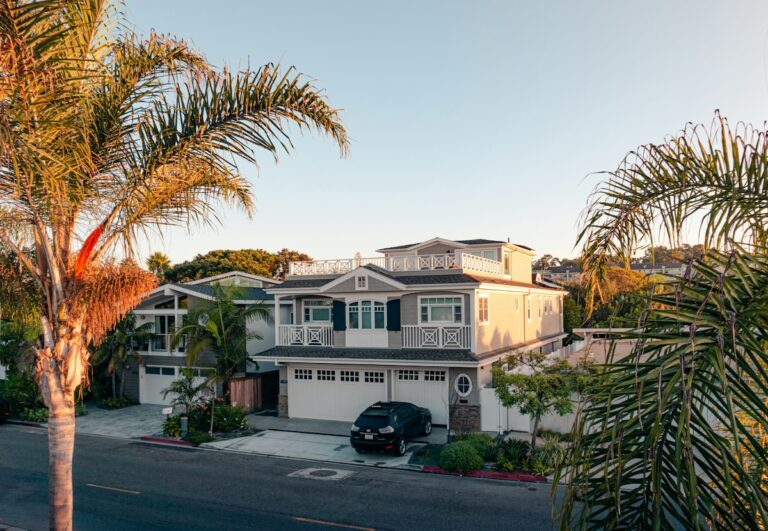 Two-story family home exterior with trees
