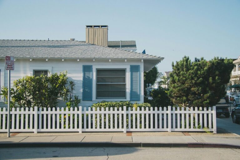 Craftsman-style bungalow house on a tree-lined Pasadena, CA street